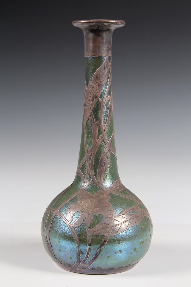 LOETZ GLASS VASE - Art Nouveau Iridescent Loetz Glass: LOETZ GLASS VASE - Art Nouveau Iridescent Loetz Glass Bottle Vase with engraved sterling silver overlay. 8" tall, 4" diam. Crack at throat, pitting to surface. From a Phippsburg Maine estate.