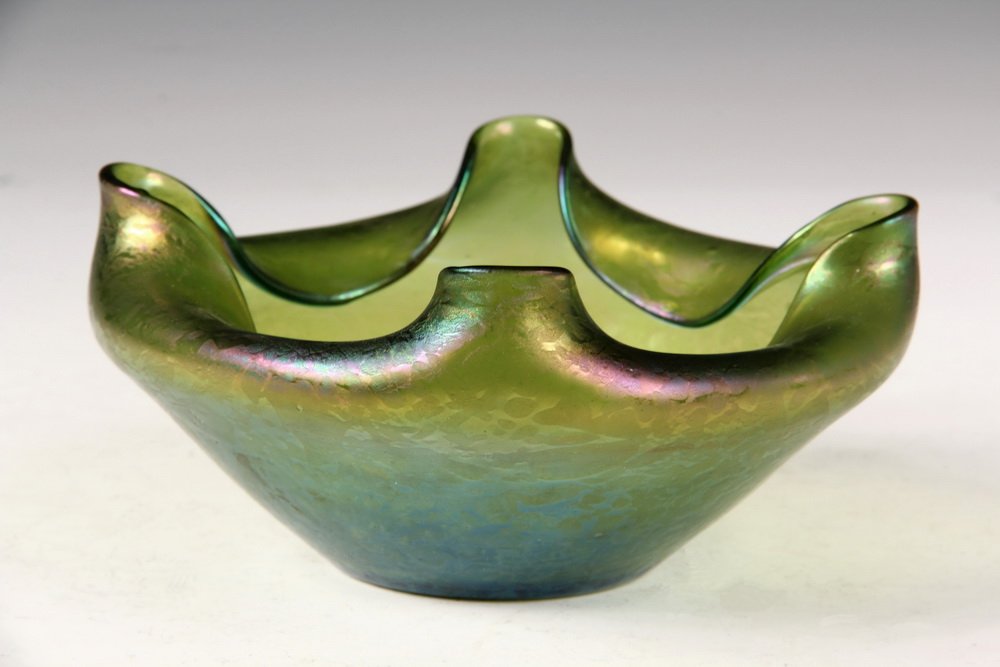 ART GLASS BOWL - Loetz Iridescent Green Bowl with: ART GLASS BOWL - Loetz Iridescent Green Bowl with folded and cornered rim, ground pontil, circa 1900. 6 1/2" diam. Very good condition, small occlusion and chip at pontil.