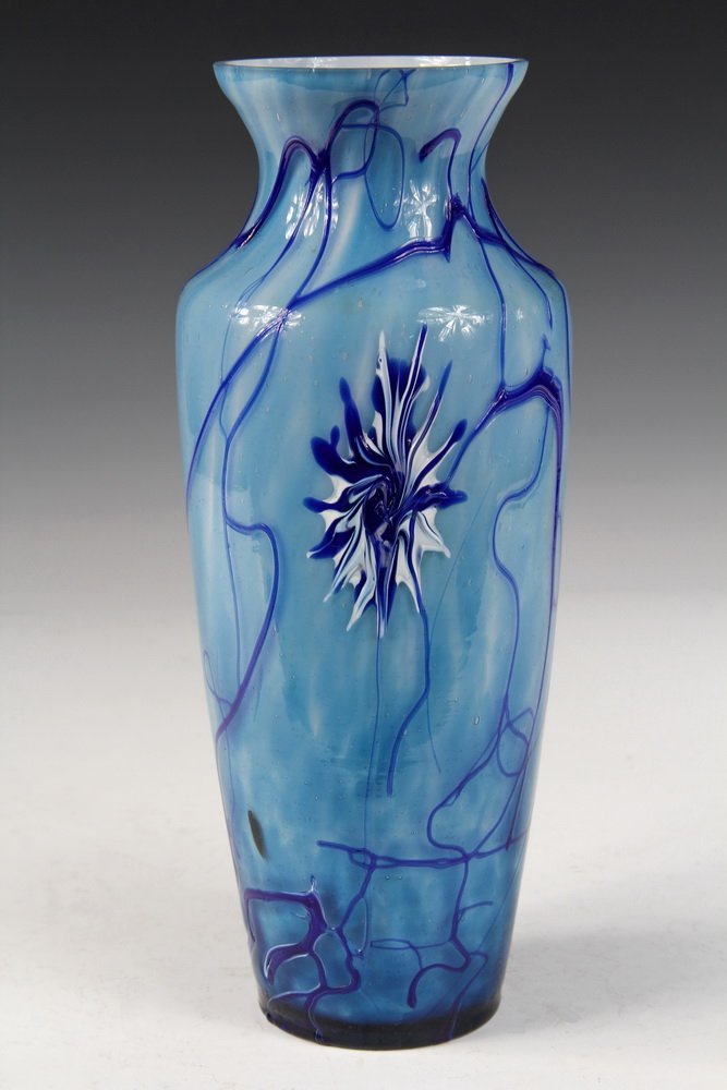 ART GLASS VASE - Pallme-Konig Bohemian Tall Vase in: ART GLASS VASE - Pallme-Konig Bohemian Tall Vase in cased striated pale blue with applied Prussian blue string and blossoms, with high shoulder, slightly flared rim. Circa 1900. 10 1/4" tall. Fine con