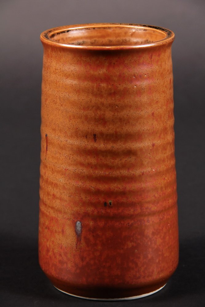 BROTHER THOMAS BEZANSON POTTERY - Ribbed and Slightly: BROTHER THOMAS BEZANSON POTTERY - Ribbed and Slightly Tapered Cylindrical Vase in iron red glaze. Signed. 7 1/4" x 4". Fine condition.