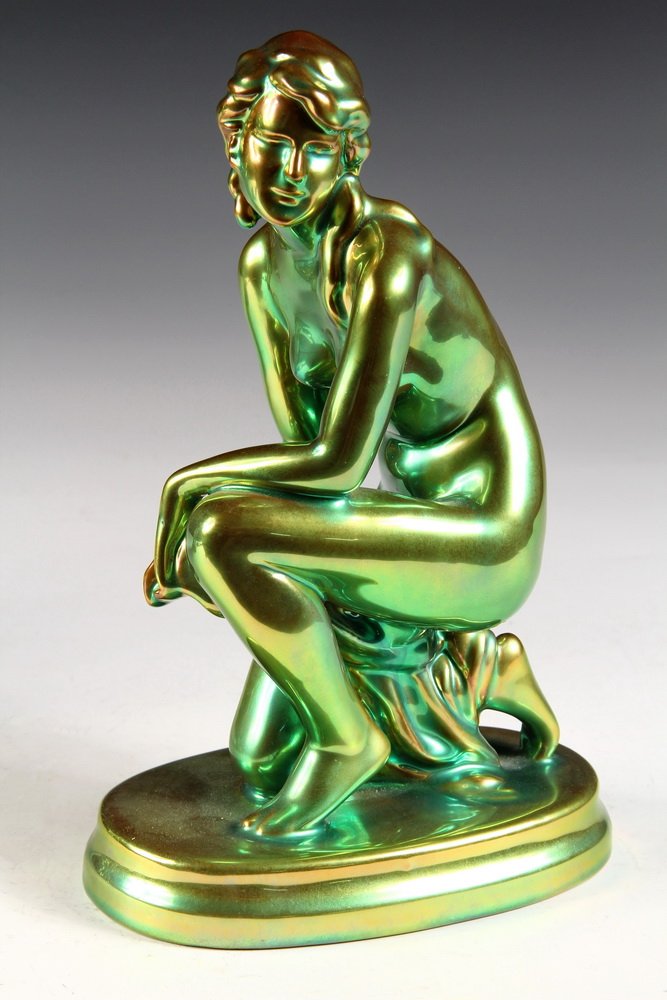 ZSOLNAY PECS EOSIN PORCELAIN - Kneeling Figure of Nude: ZSOLNAY PECS EOSIN PORCELAIN - Kneeling Figure of Nude Woman with cloth draped over one thigh, circa 1930s. Factory established by Miklos Zsolnay (1800-1880), in Pecs, Hungary. 9 3/4" tall. Fine condi