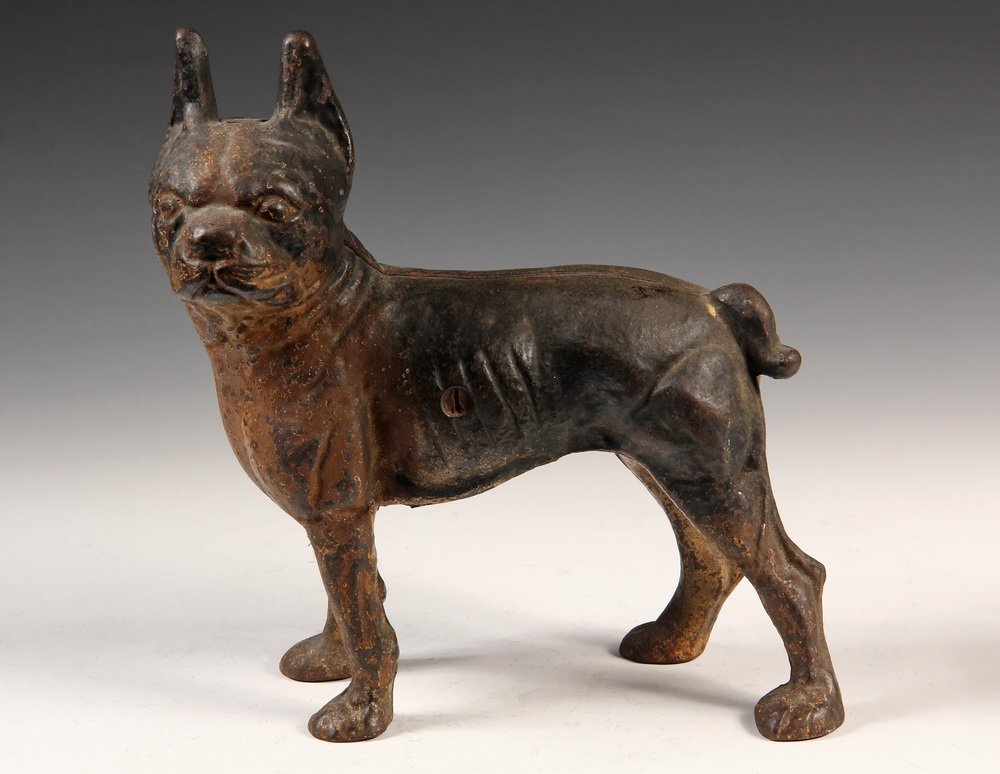 FIGURAL CAST IRON DOORSTOP - Fully Dimensional Standing: FIGURAL CAST IRON DOORSTOP - Fully Dimensional Standing Boston Terrier Dog in remnants of black and white paint, unmarked, circa 1910. 8 1/2" long. Some corrosion.