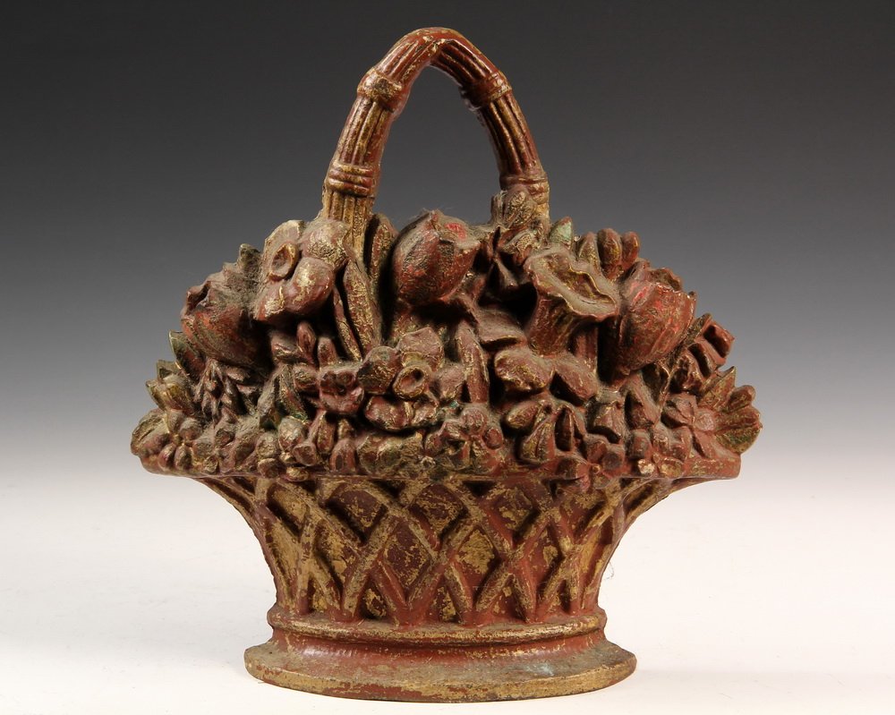 CAST IRON FLORAL DOORSTOP - 19th c. Flower Basket Form: CAST IRON FLORAL DOORSTOP - 19th c. Flower Basket Form Doorstop with remnants of gilding over red paint. 11 1/2" tall. Gilding mostly gone, nice patina.