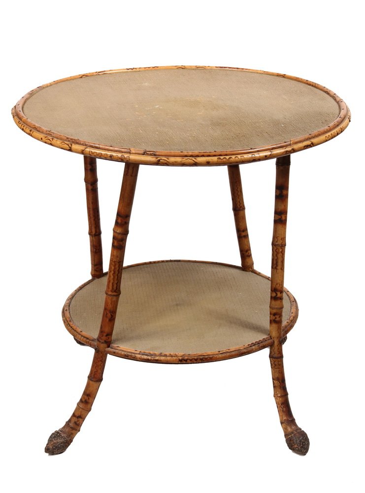 ROUND BAMBOO TABLE - Scorched Bamboo Stand with lower: ROUND BAMBOO TABLE - Scorched Bamboo Stand with lower shelf, having woven & painted seagrass covering, the legs ending in root balls. Circa 1890. 24" x 25" diam. Good condition.