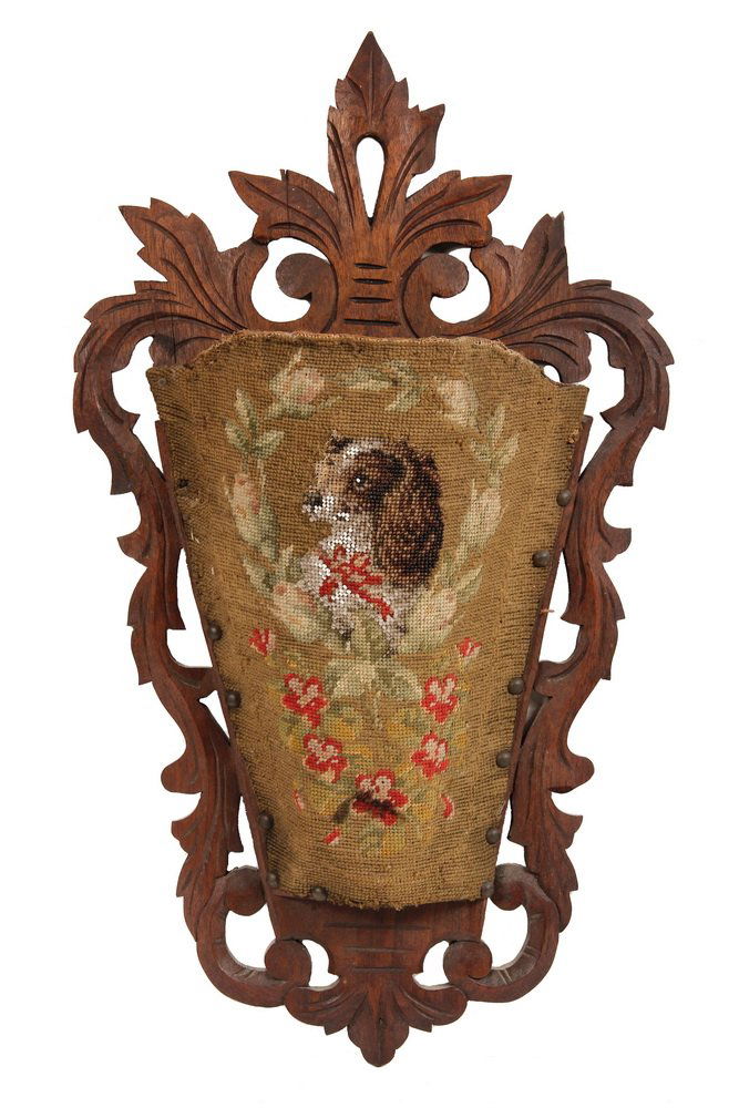 VICTORIAN WALL POCKET - Carved Red Walnut, Needlepoint: VICTORIAN WALL POCKET - Carved Red Walnut, Needlepoint and Beaded Wall Slipper Pocket depicting a King Charles Spaniel, with floral wreath. 22 3/4" tall. Some loss to the glass beadwork.