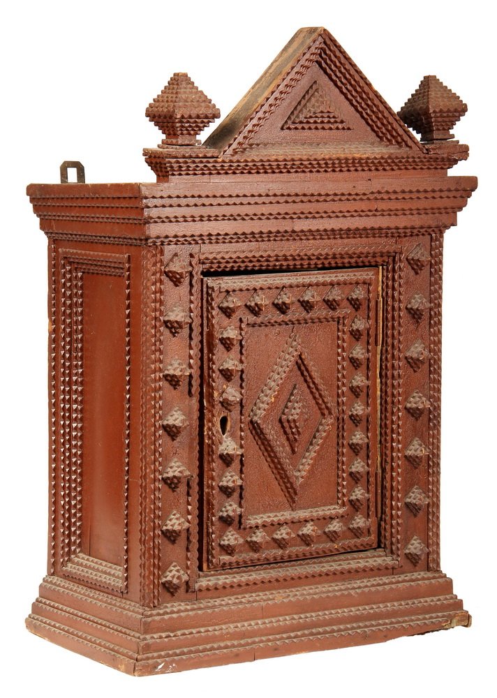 FOLK ART WALL CABINET - Victorian Tramp Art Chip Carved: FOLK ART WALL CABINET - Victorian Tramp Art Chip Carved Wall Cabinet in red painted pine, with gabled top flanked by finials, molded top and bottom, diamond decorated door flanked by diamond posts. Lo