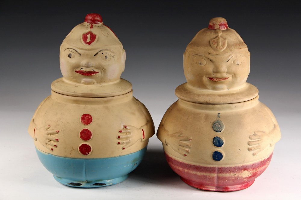 (2) FIGURAL COOKIE JARS - Unmarked 1920s Glazed: (2) FIGURAL COOKIE JARS - Unmarked 1920s Glazed Stoneware Roly-Poly Figures, in red, blue & orange. 12 3/4" tall. Worn.
