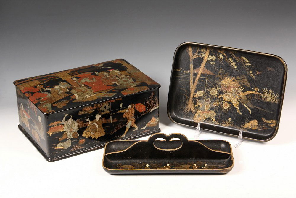 (3 PCS) JAPANESE LACQUER - Jewelry Box decorated with: (3 PCS) JAPANESE LACQUER - Jewelry Box decorated with gilt polychrome genre scenes, 4 1/2" x 10 1/2" x 7"; Oblong Tray with fighting Samurai, 7 1/4" x 10"; Pen Tray with central handle, 10 1/2" x 5".