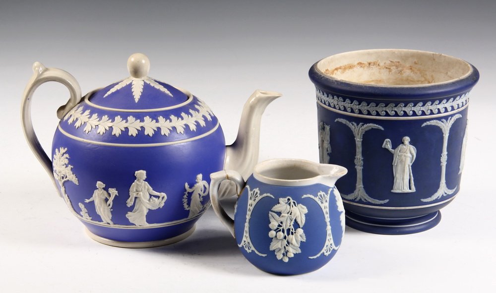 (3 PCS) WEDGWOOD - Blue Jasperware Tea Pot, Creamer &: (3 PCS) WEDGWOOD - Blue Jasperware Tea Pot, Creamer & Plant Pot, the first and last with Romanesque decoration, the creamer with grapes and wheat sheaf. 3 1/2" to 6" tall. All damaged.