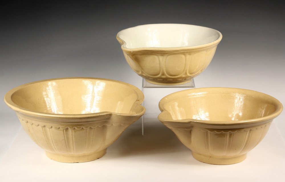 (3) LARGE YELLOWARE MIXING BOWLS - Circa 1910s Mixing: (3) LARGE YELLOWARE MIXING BOWLS - Circa 1910s Mixing Bowls with Spouts, American, of various patterns, one with white interior. 12" to 14" diam. Chips, hairlines.