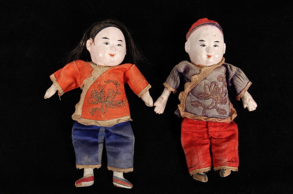 (2) EARLY CHINESE DOLLS - Late 18th to Early 19th c: (2) EARLY CHINESE DOLLS - Late 18th to Early 19th c. Chinese Dolls in lacquered papier mache, with silk clothing and bullion thread detail, real human hair on the girl, the boy with cap, sawdust fille