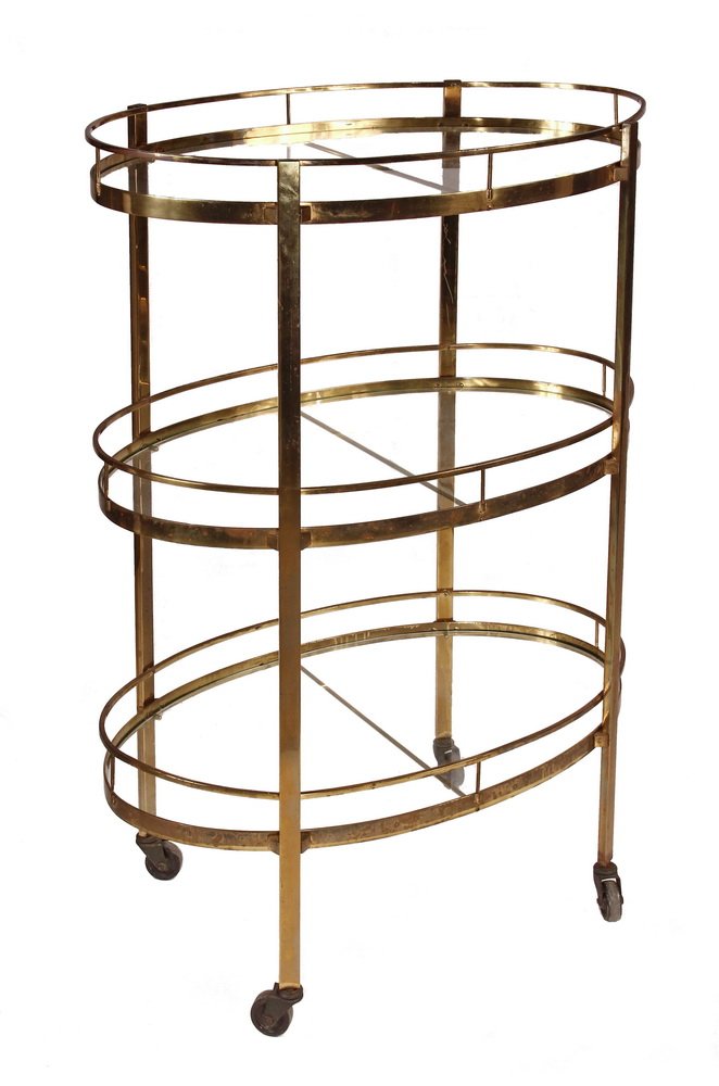 DECO SERVICE CART - 1930s American Solid Brass & Glass: DECO SERVICE CART - 1930s American Solid Brass & Glass Three-Level Oval Serving Cart or Liquor Stand, on wheels. 42 1/2" x 30 1/2" x 18 1/2". Wear to lacquer on brass.