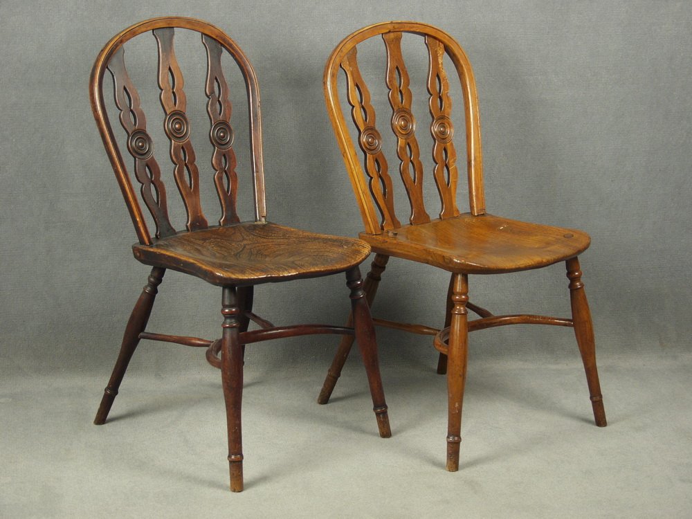 SIDECHAIRS - Pair of 18th c. Bowback Yew Wood Windsor: SIDECHAIRS - Pair of 18th c. Bowback Yew Wood Windsor Sidechairs, with pierced slats and center rosettes, curved stretcher, 36" tall, 16 1/2" x 16", piece of wood missing from back hoop of one chair.