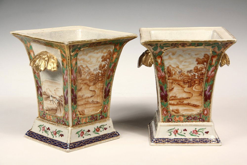 PAIR OF CHINESE BOUGH POTS - Typical Square Form: PAIR OF CHINESE BOUGH POTS - Typical Square Form tapered body porcelain pots, having leaf-form gilt handles, sepia scenic & fauna panels surrounded by famille rose & gilt ground, stepped bases. Late 1