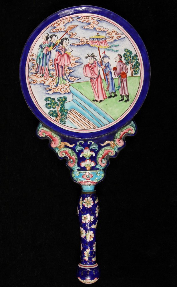 CHINESE HAND MIRROR - Peking Enamel, cobalt blue: CHINESE HAND MIRROR - Peking Enamel, cobalt blue ground, woman presenting a baby to her husband on reverse, gilt greek key edge, blossom and gilt web border and handle, polychrome scrollwork yoke. 15