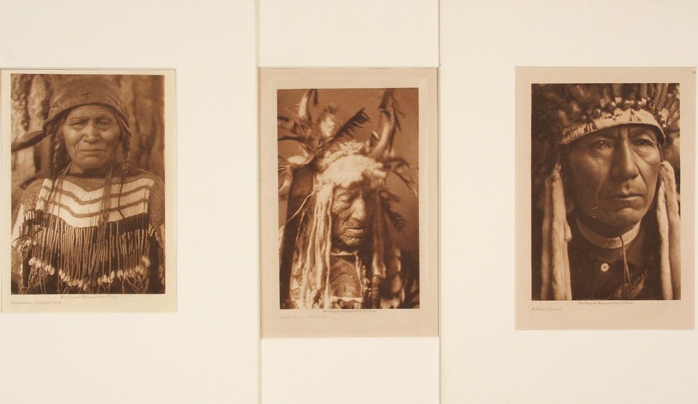 (3) CURTIS PHOTOGRAVURES - "Flathead Female Type",: (3) CURTIS PHOTOGRAVURES - "Flathead Female Type", 1910, and "Lean Wolf, Hidasta", 1908, on Japan tissue, plus "A Nez Perce", 1910, on Dutch van Gelder, by Edward S. Curtis (1868-1952), 5" x 7" format