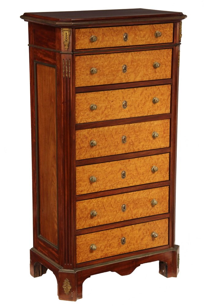 LINGERIE CHEST - 19th c. French Classical form, in: LINGERIE CHEST - 19th c. French Classical form, in mahogany with brass molding and gilt ormolu mounts, six (one double-depth) bird's-eye maple front drawers with cast brass fleurette pulls, between sp
