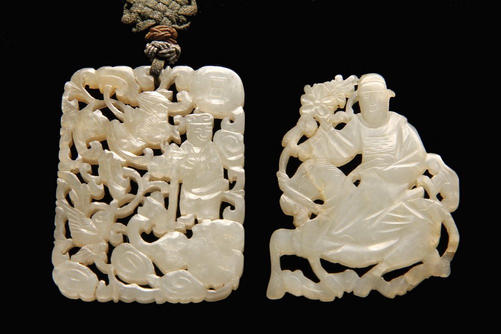 (2) CHINESE JADE PENDANTS - Mutton Fat Reticulated: (2) CHINESE JADE PENDANTS - Mutton Fat Reticulated Pendants: Oblong with traveler, bird, bat and gourd set into scrollwork, 2 1/2" x 1 3/4", with original silk cord; PLUS Man riding horse holding flow