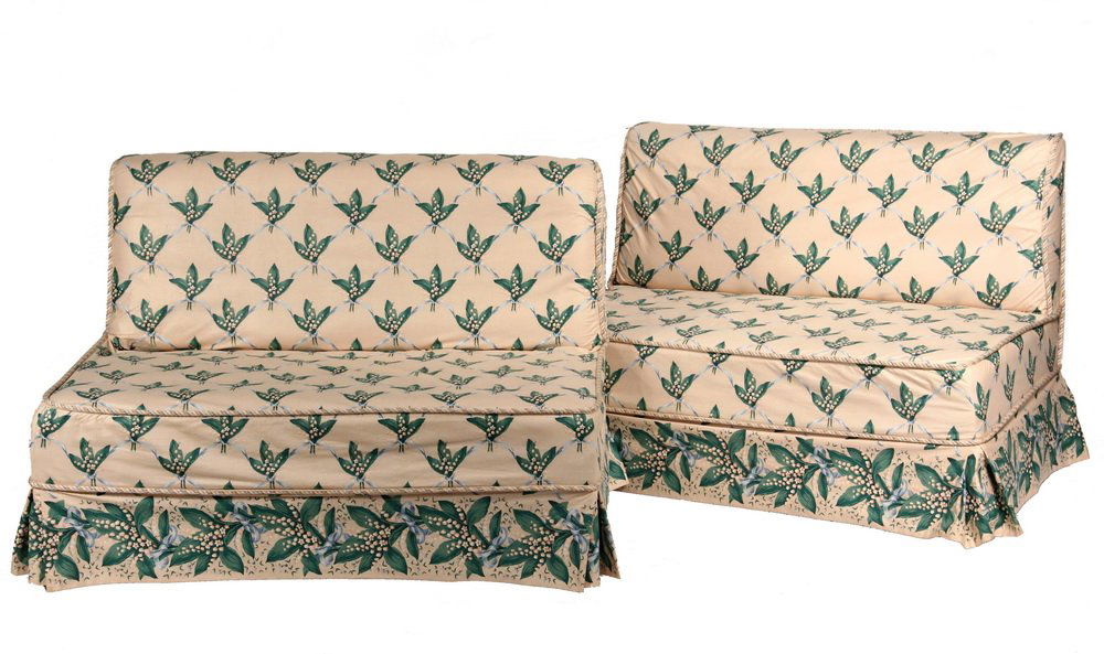 PAIR OF UPHOLSTERED WINDOW SEATS - 1930s Vintage: PAIR OF UPHOLSTERED WINDOW SEATS - 1930s Vintage Armless Settees in Lily-of-the-Valley chintz slipcovers, with complimentary roping trim. 30" back, 15" seat, 42" x 25". Good condition.