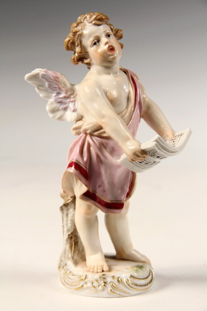 MEISSEN FIGURINE - Late 19th c. Meissen Porcelain: MEISSEN FIGURINE - Late 19th c. Meissen Porcelain Figurine depicting a singing cherub. With crossed swords underglaze blue mark, impressed mark '0192' and '111'. 6 1/2" h, 3" w, 3 1/2" d. Fine conditi
