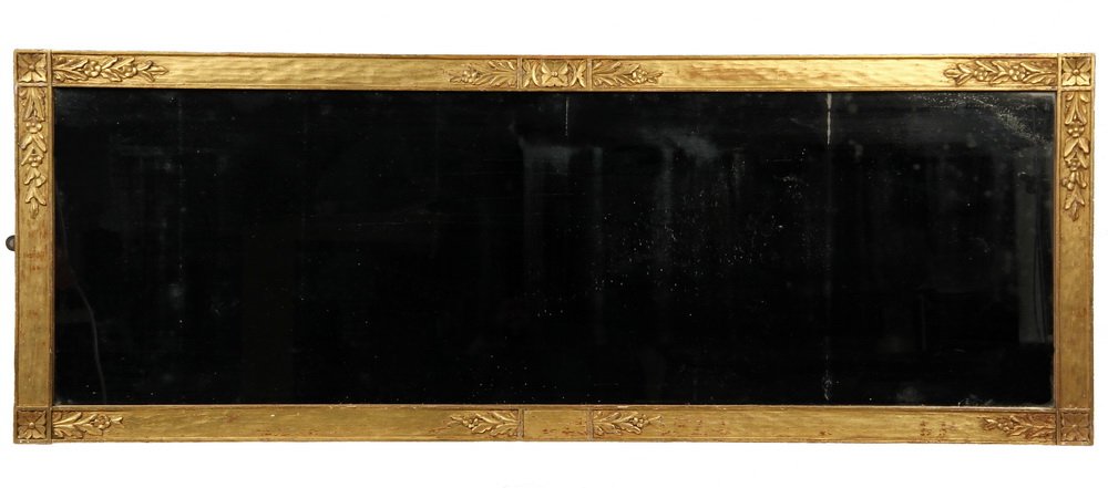 ARTS & CRAFTS PERIOD MIRROR - Over Mantel Mirror in: ARTS & CRAFTS PERIOD MIRROR - Over Mantel Mirror in hand carved and gilt frame with assymetrical floral motif, old glass. Brass tag on back from Foster Brothers, Boston, Mass. Circa 1910. 24" x 66". S