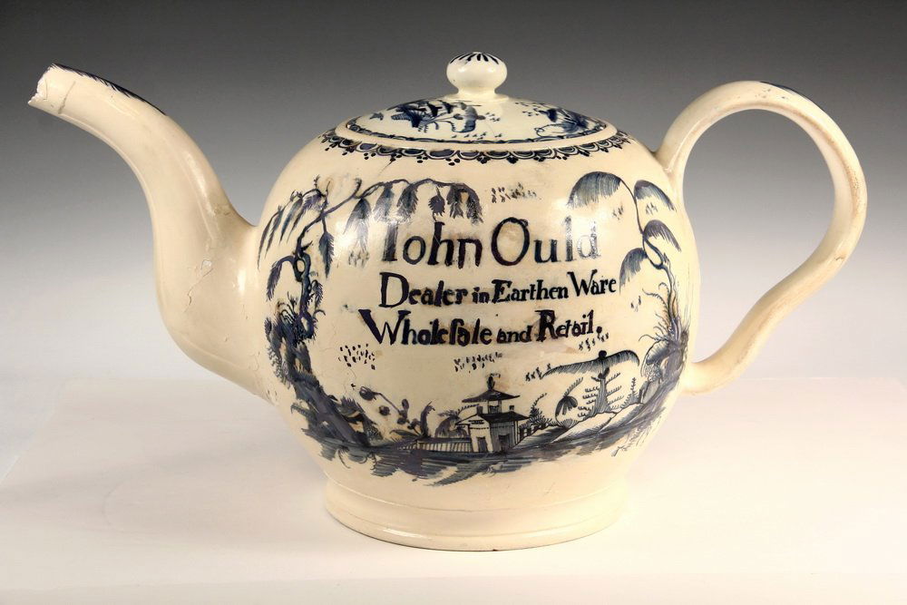 TRADE ADVERTISEMENT - 19th c. Oversized English Soft: TRADE ADVERTISEMENT - 19th c. Oversized English Soft Paste Tea Pot inscribed "John Ould, Dealer in Earthenware, Wholesale and Retail". From the estate of Brooke Astor. 14" x 25" x 12". Extensive old r