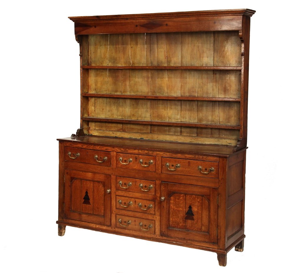 TWO-PART WELSH DRESSER - Oak Cupboard with three shelf: TWO-PART WELSH DRESSER - Oak Cupboard with three shelf top having a deep molded cornice, inlaid fascia, plank back and molded bracket foot, exposed tenons; the lower case having three drawers over cen