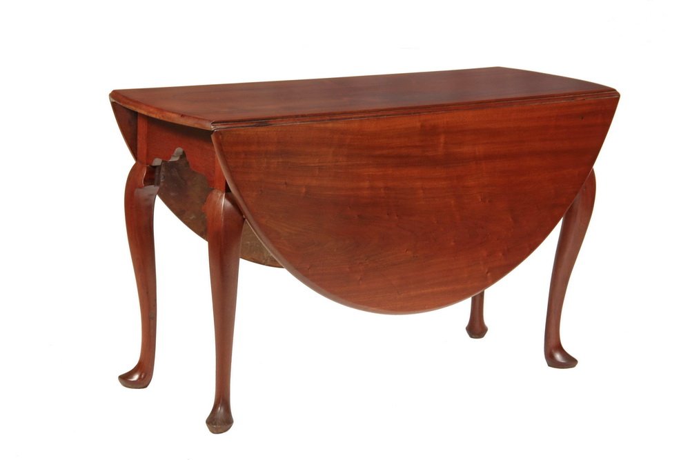 DROPLEAF DINING TABLE - Fine Mid-18th c. Irish or: DROPLEAF DINING TABLE - Fine Mid-18th c. Irish or English Queen Anne Oval Top Table in dense figured mahogany, with nicely carved and shaped apron, set on four cabriole legs terminating in pointed Que