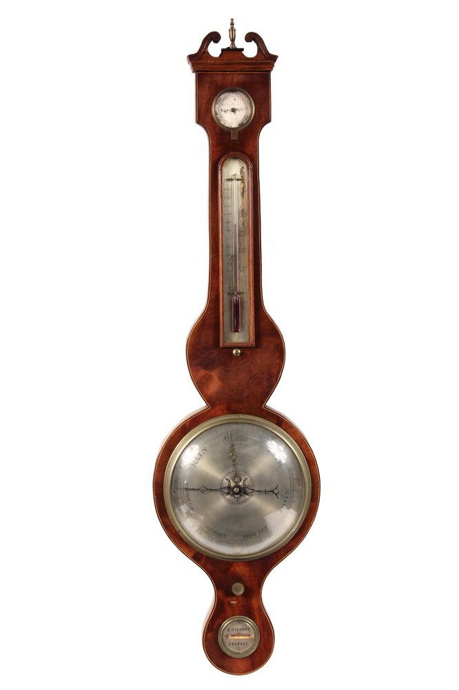 ANEROID BAROMETER - Georgian Banjo-Shaped Mercury Wheel: ANEROID BAROMETER - Georgian Banjo-Shaped Mercury Wheel Barometer by E. Gilbert, Belfast, Ireland, in mahogany case, having broken pediment with brass finial, thermometer, hygrometer & level with silv