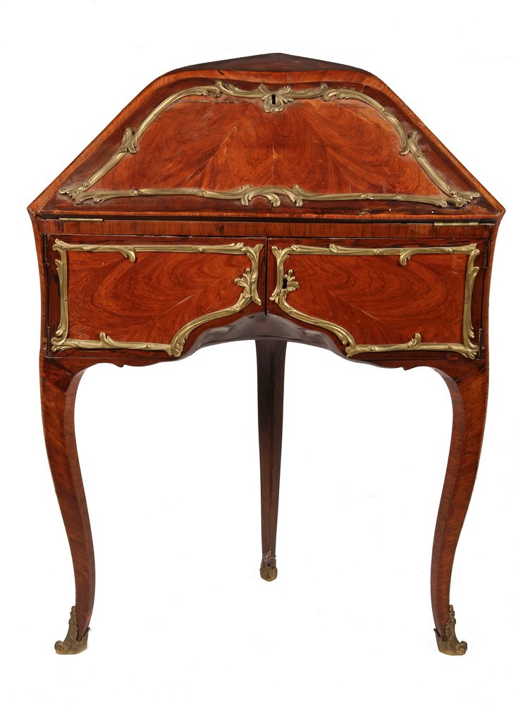 FRENCH CORNER DESK - Louis XV Lady's Escritoire in: FRENCH CORNER DESK - Louis XV Lady's Escritoire in fruitwood veneer with gilt ormolu panel frames and mounts, shaped top drop-front with red velvet writing surface, single drawer, two hinged fronts re