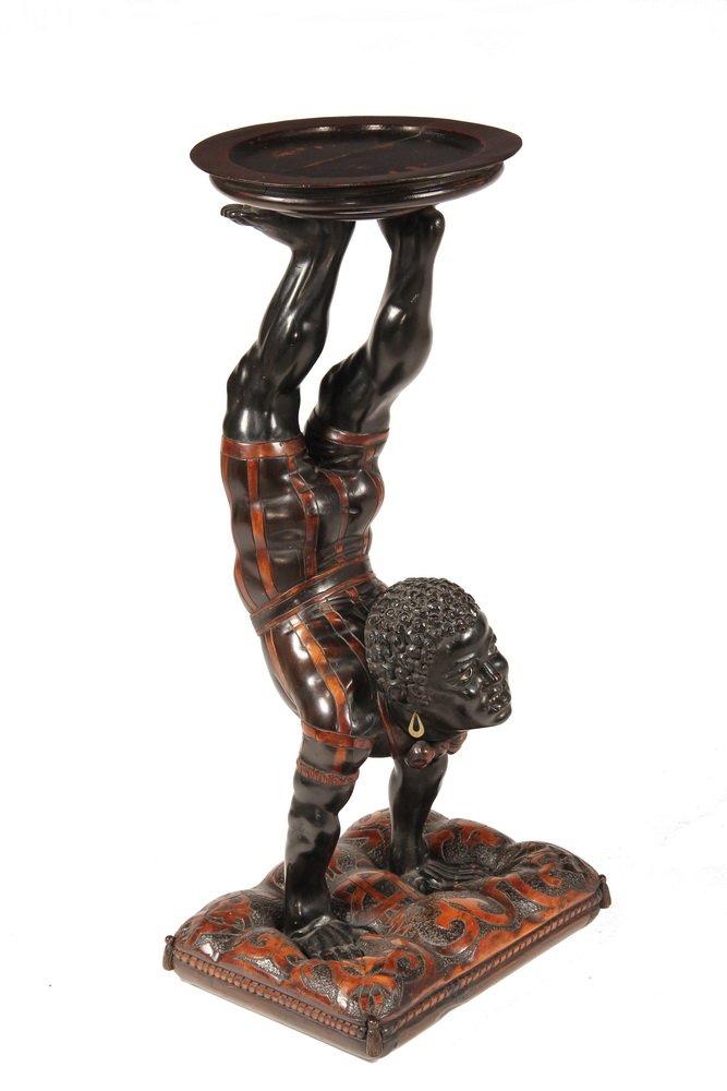 BLACKAMOOR HALL STAND - 19th c. Carved and Partly: BLACKAMOOR HALL STAND - 19th c. Carved and Partly Ebonized Mahogany Figure of a Blackamoor Acrobat, doing a handstand on a pillow with a small round tray supported by his feet. 31 1/2" tall, 12" diam 