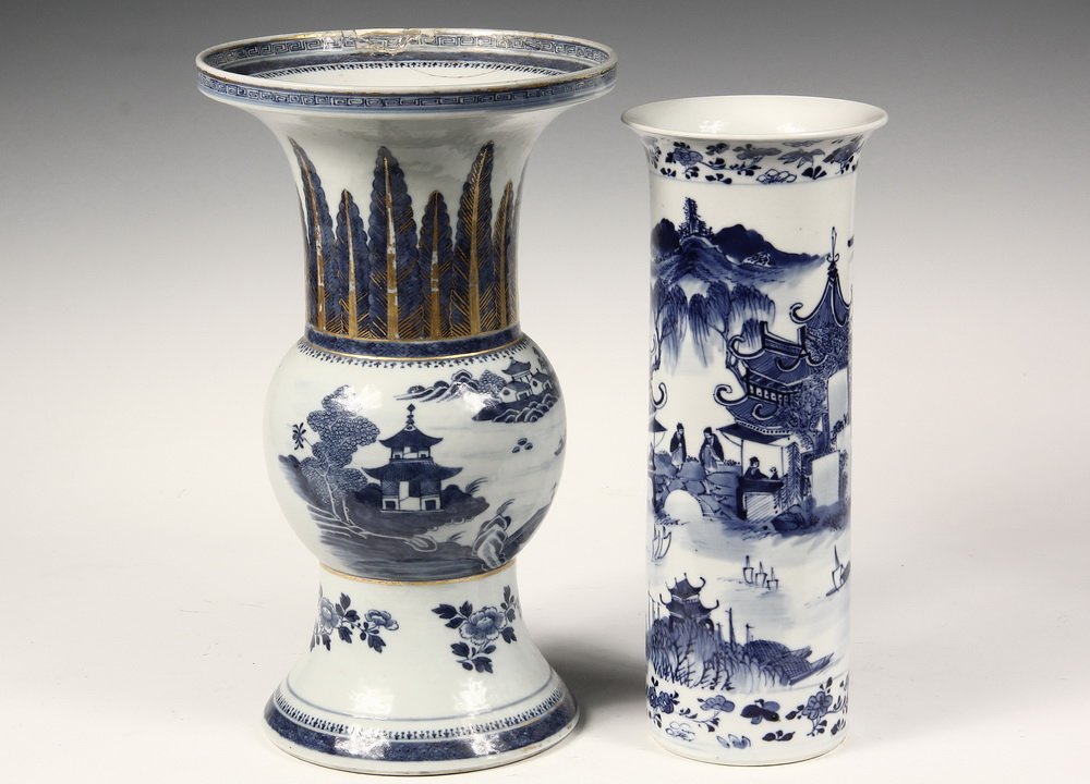 (2) CHINESE EXPORT VASES - 19th c. Blue & White: (2) CHINESE EXPORT VASES - 19th c. Blue & White Cantonese Vases, one in classical Gu form, with landscape, gilt detailed leaves above, 13 1/4" tall, old staple repairs to rim; PLUS the second in cylin
