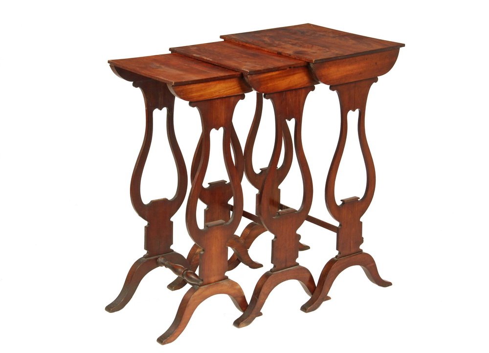 NEST OF THREE STACKING TABLES - 19th c. Classical Style: NEST OF THREE STACKING TABLES - 19th c. Classical Style Graduated Nesting Tables in mahogany with quartered crotch veneer tops, lyre form supports, high arch carved trestle bases, turned stretcher to