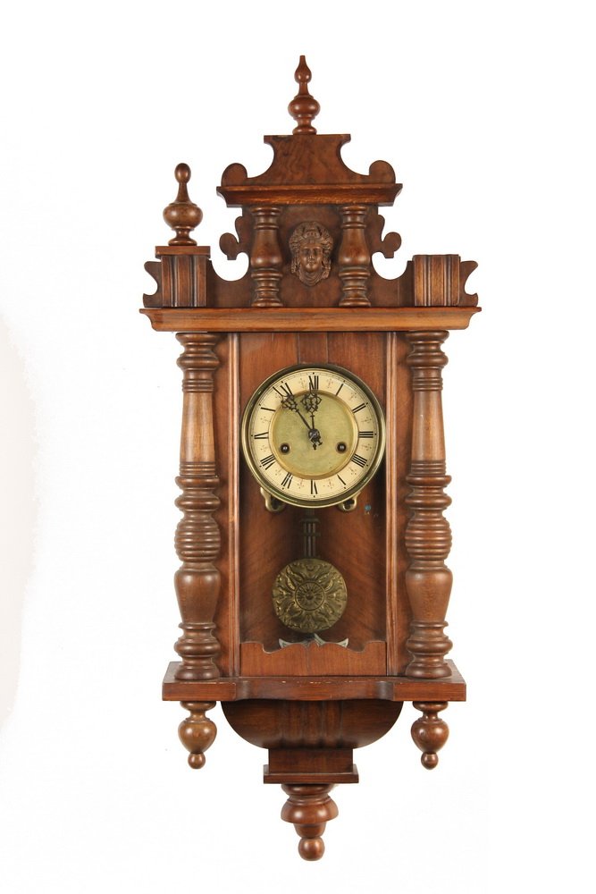 VIENNA REGULATOR WALL CLOCK - Late 19th c. German Wall: VIENNA REGULATOR WALL CLOCK - Late 19th c. German Wall Clock in walnut case with split tuned columns, pediment with classical head, 8-day time and strike brass works with enameled ring dial, pressed b
