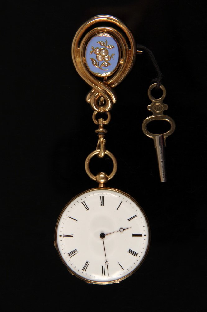 PENDANT WATCH - 18K Yellow Gold Lady's Pendant Watch: PENDANT WATCH - 18K Yellow Gold Lady's Pendant Watch with blue enamel, set with (14) seed pearls containing an A. Geneve key wind key set movement, by Henry Capt, ca 1860. Includes a Chatelaine pin wh