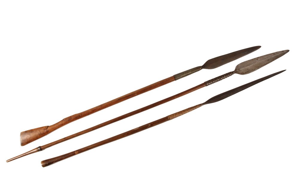 (3) COLONIAL AFRICA FIGHTING SPEARS - Zulu/Nguni Spears: (3) COLONIAL AFRICA FIGHTING SPEARS - Zulu/Nguni Spears with iron tips, wooden handles, including: Two Isijua, or throwing spears, both with wire wraps, one with unusual rifle butt shaped shaft, 52 1/