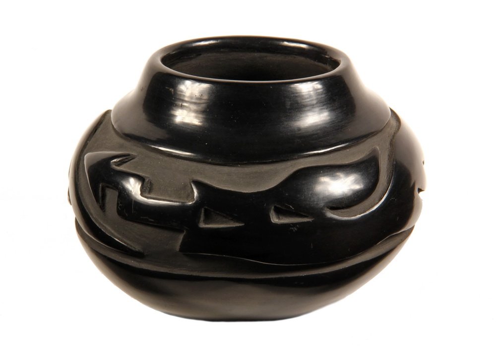 NATIVE AMERICAN POTTERY - Dolorita Gutierrez, Santa: NATIVE AMERICAN POTTERY - Dolorita Gutierrez, Santa Clara Pueblo, New Mexico, black on black, boldly carved with the Avanyu water serpent, inscribed by artist under base. 4 3/4" x 6 1/2" diam. Fine co