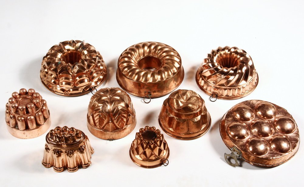 (9 PCS) GERMAN TIN-LINED COPPER MOLDS - All late 19th: (9 PCS) GERMAN TIN-LINED COPPER MOLDS - All late 19th to early 20th c, all but one mold are handmade. Includes: Two Alsace Kugelhopf molds of intricate design, one with dovetailed seams, along with a 