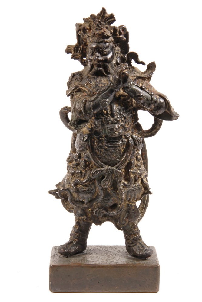 CHINESE BRONZE FIGURE - Ming Dynasty (16th-17th c): CHINESE BRONZE FIGURE - Ming Dynasty (16th-17th c) Dhanada, Guardian King of the North, in ornate armor with billowing scarves, magnificent headgear, in remnants of gilding, on later bronze base. 12" 