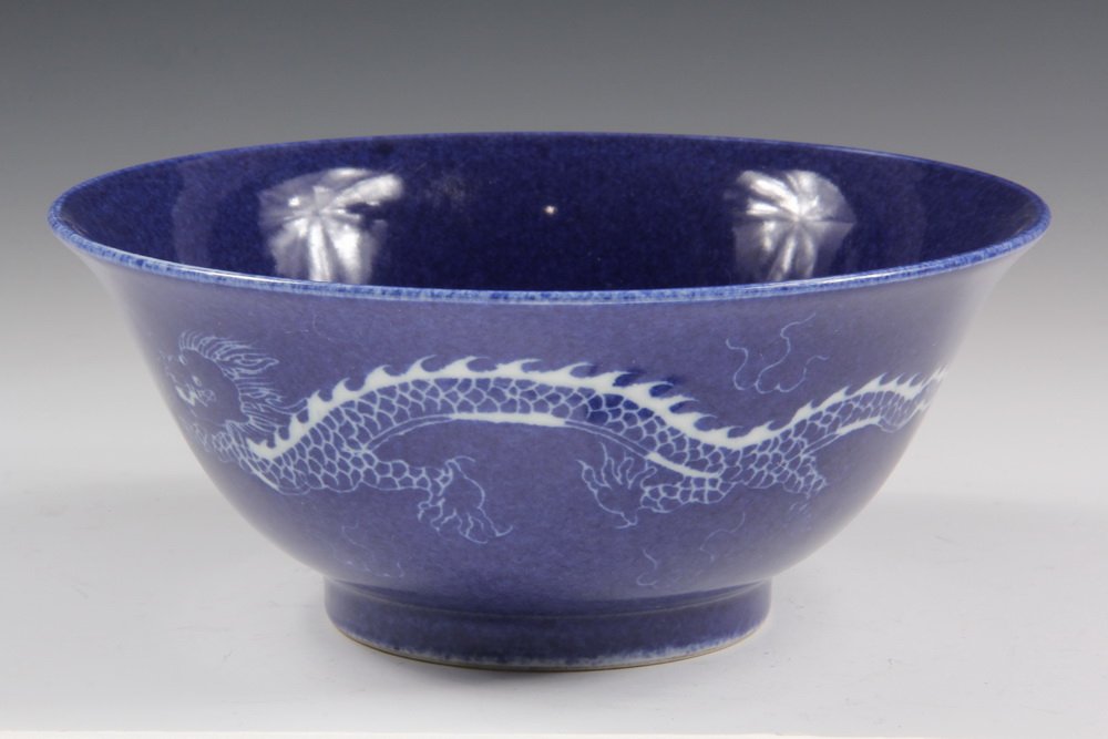 CHINESE PORCELAIN BOWL - Deep Serving Bowl in powder: CHINESE PORCELAIN BOWL - Deep Serving Bowl in powder blue having white decoration of dragons with flaming pearls on outside, pair of phoenix birds on inside, underglaze blue Kangxi mark. 3 1/4" x 7 1/