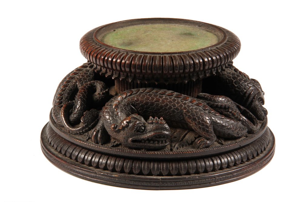 ORIENTAL POTTERY STAND - 19th c Chinese Huali Rosewood: ORIENTAL POTTERY STAND - 19th c Chinese Huali Rosewood Pedestal with three finely carved horned dragons, lotus leaf edged upper and lower rims. Receives 3 3/4" diam vase. 3 1/2" x 7 1/4" diam. A few t