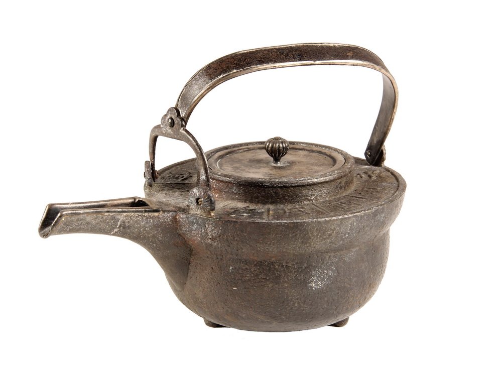 CHINESE IRON TEAPOT - Qing Dynasty Cast Iron Pot with: CHINESE IRON TEAPOT - Qing Dynasty Cast Iron Pot with long flat spout, arched handle, characters of the 'Twelve Earthly Cycles' around the edge of the flat top, pivot handle has secondary yoke mount a
