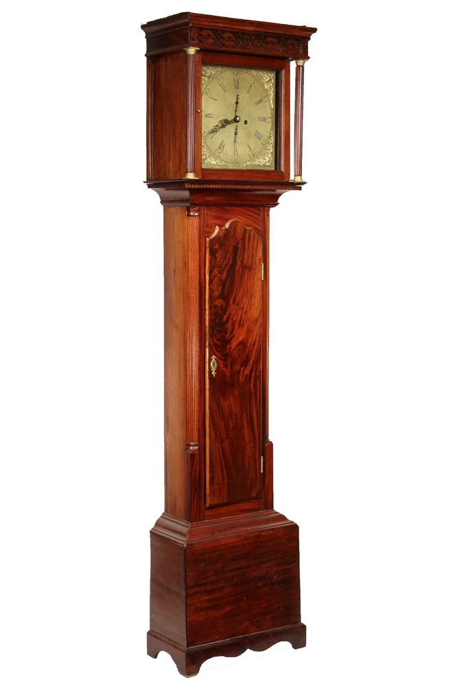 IRISH TALL CLOCK - Uniacke & Henry of Dublin Tall Clock: IRISH TALL CLOCK - Uniacke & Henry of Dublin Tall Clock in a Chippendale Figural Mahogany Case, circa 1780, having a flat top with molded cornice, fretwork frieze and full round fluted columns with br