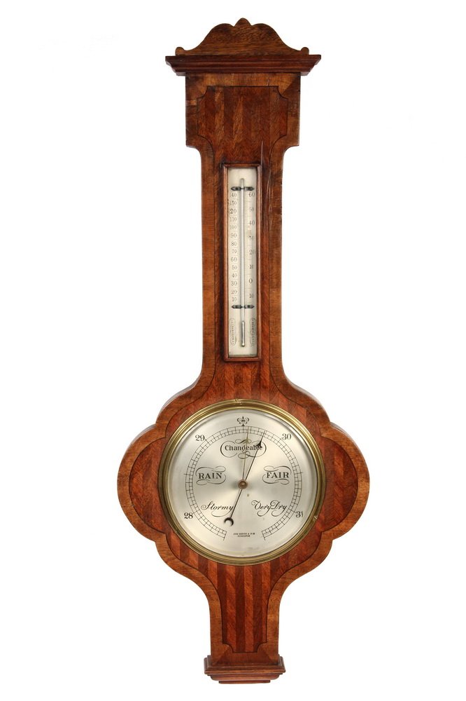 BAROMETER - Aneroid Barometer and Thermometer in: BAROMETER - Aneroid Barometer and Thermometer in Italianate Style Banded Mahogany Case, made for John Barker & Co, Ltd., of Kensington, having engraved silvered vernier scale and dial, circa 1890, the