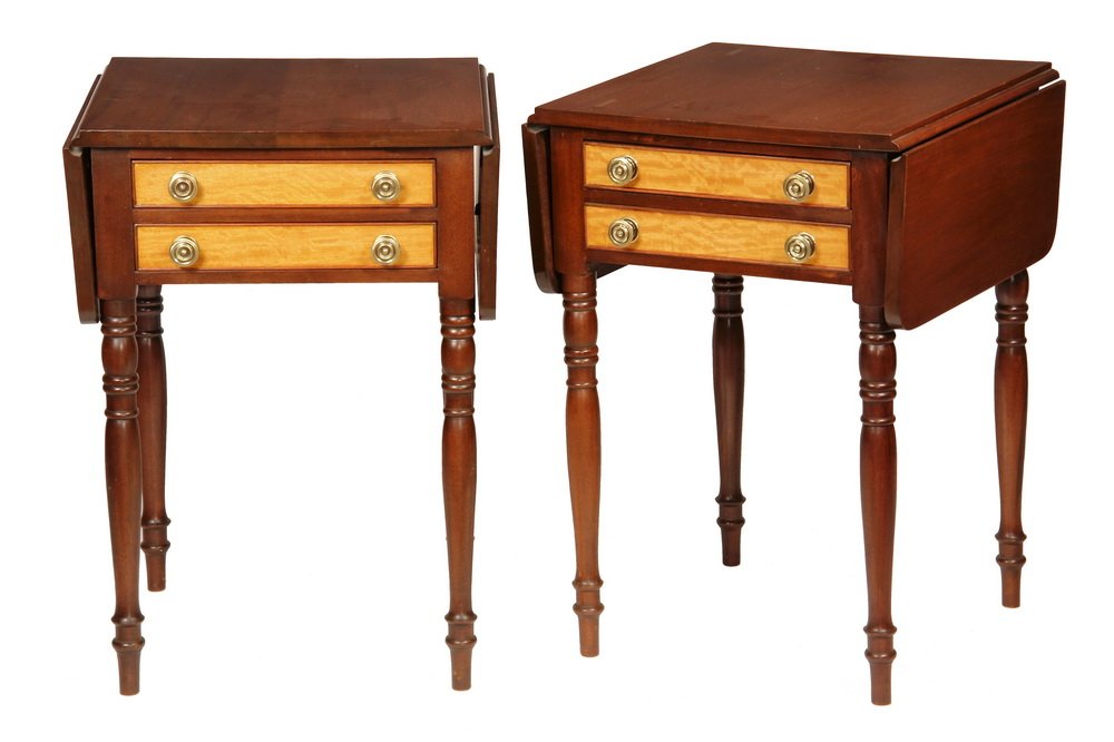 PAIR OF SHERATON STANDS - Mahogany Dropleaf Stands with: PAIR OF SHERATON STANDS - Mahogany Dropleaf Stands with figured satinwood fronts to the double drawers, having beaded edges and later brass pulls, ring turned legs First quarter 19th c. 27 1/2" x 19" 