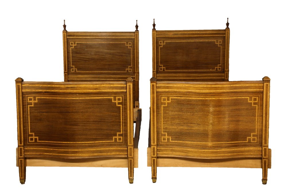 PAIR OF REGENCY STYLE TWIN BEDS - Circa 1910 mahogany: PAIR OF REGENCY STYLE TWIN BEDS - Circa 1910 mahogany and banded inlay beds. Flat headboards with molded rails and finials, bowed footboard with molded rail and caps. Hardwood planks to accomodate mod