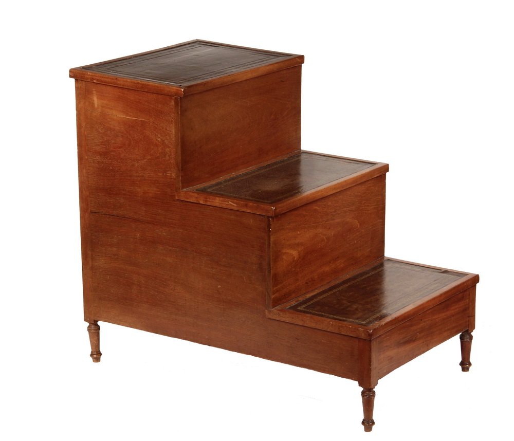BED STEPS - Set of Sheraton Period Bed Steps, in: BED STEPS - Set of Sheraton Period Bed Steps, in mahogany, having tooled leather treads on each of the three risers, set on short turned legs, 27" x 31" x 18 1/2". Shrinkage cracks to sides.