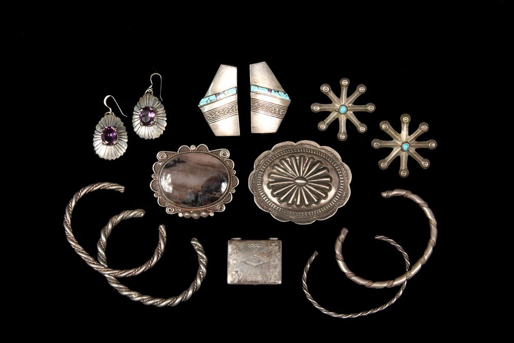(10) PCS JEWELRY - Group of (10) Pieces of Silver: (10) PCS JEWELRY - Group of (10) Pieces of Silver Native American Jewelry, mostly Navajo made, including (2) brooches, (3) pairs of earrings, a pill box, and (4) bangle bracelets. Including: Circa 190
