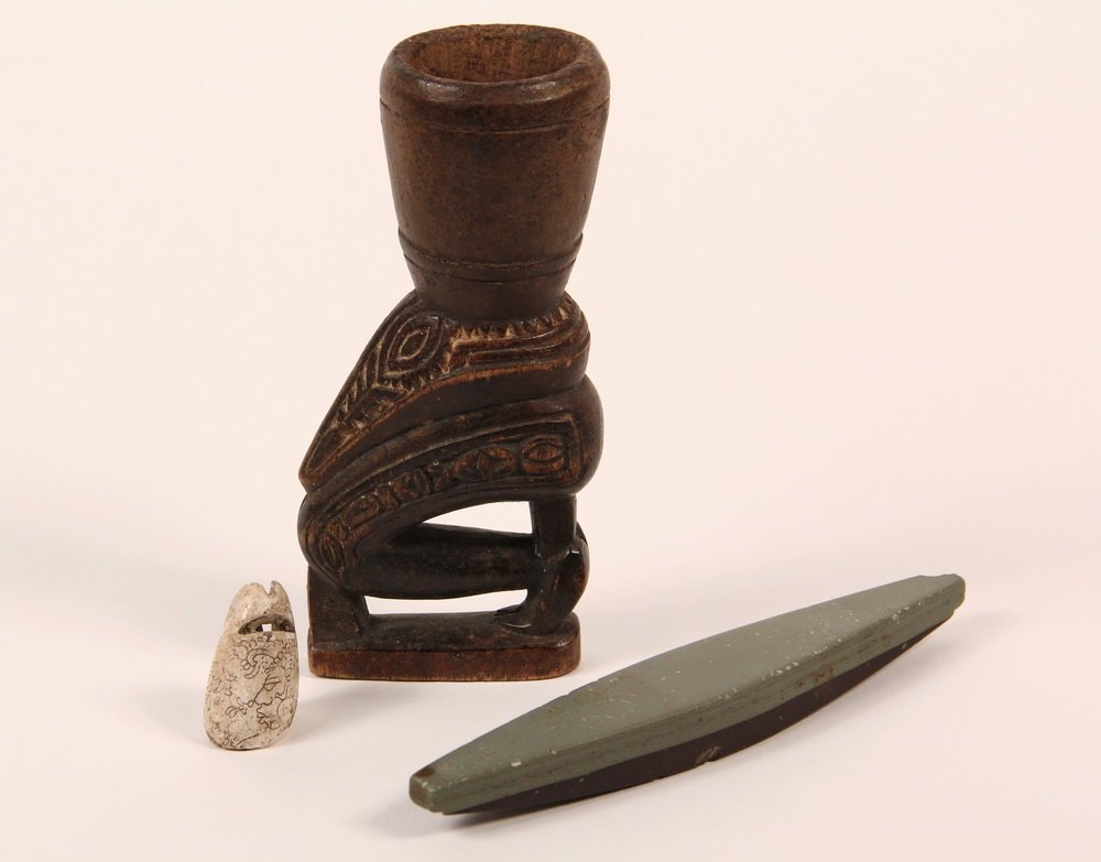 (3) ETHNIC COLLECTIBLES - Pre-Columbian Engraved Spiral: (3) ETHNIC COLLECTIBLES - Pre-Columbian Engraved Spiral Shell, (circa. 500 - 800 A.D.) decorated with an engraved image of a Mayan deity and having an ancient suspension slit; probably part of a neckl