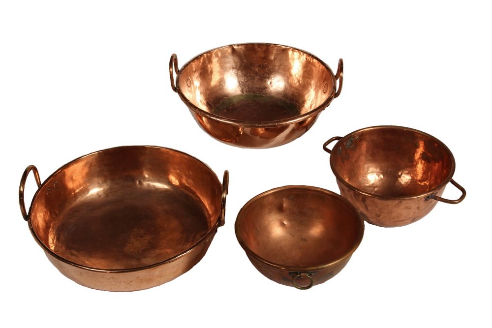 (4 PCS) EARLY HAND-HAMMERED COPPER COOKWARE - Round: (4 PCS) EARLY HAND-HAMMERED COPPER COOKWARE - Round Bottom Candy Cookers, or Mixing Bowls, in graduated sizes, but not a set, the largest with vertical D handles; the second largest, with vertical D h